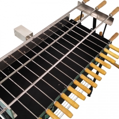 Black electric grilled skewers with rotating Cyprus style charcoal grill