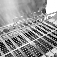 Outdoor barbecue with wind deflector stainless steel Cyprus-style rotisserie barbecue grill.